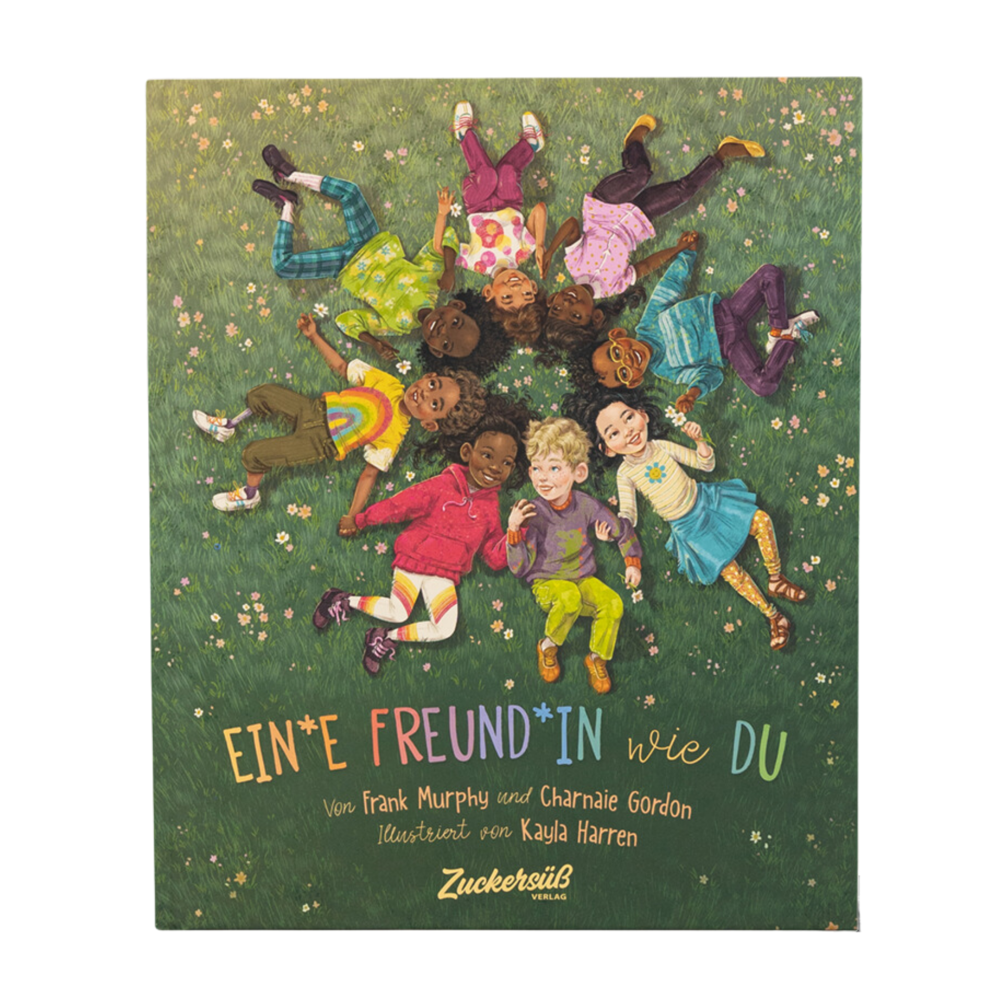 Das Cover von "Ein*e Freund*in wie du" von Frank Murphy & Charnaie Gordon zeigt Kinder, die in einem Kreis im Gras liegen, sich an den Händen halten und lächeln, als Symbol für Freundschaft. Der Titel und die Namen der Schöpfer sind angegeben.